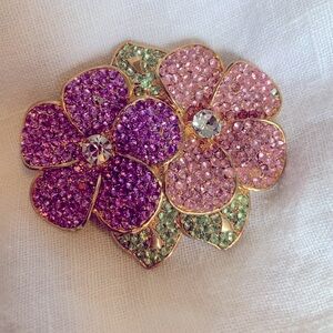 Pink and Lavender rhinestone brooch with green leaves set in goldtone